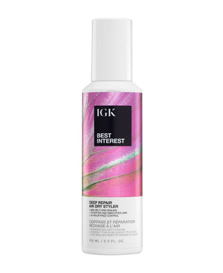 a white bottle with pink and purple label